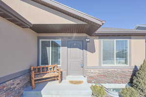 Property entrance with covered porch