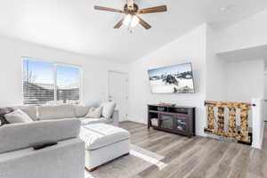 Living room with vaulted ceilings.