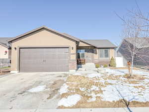 Ranch-style home with a garage