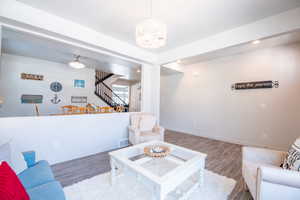 Living room with hardwood / wood-style floors