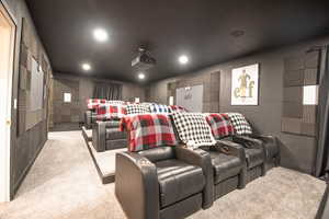 Home theater featuring light colored carpet