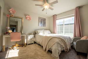 Bedroom with ceiling fan and carpet
