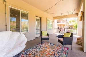 View of patio featuring a balcony