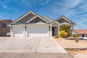 View of front facade featuring a garage