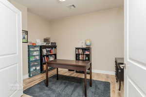 Office space featuring light hardwood / wood-style flooring