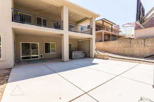 Back of house with a patio area