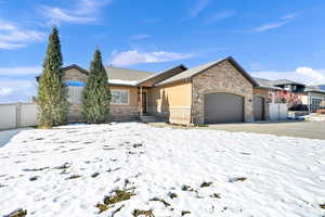 Ranch-style house featuring a garage