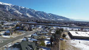 Snowy aerial view with a mountain view