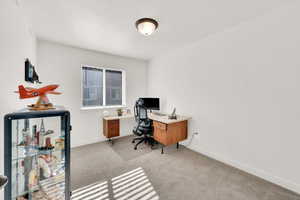 Office area featuring light colored carpet