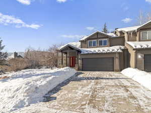 View of front of property with a garage