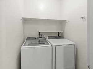 Clothes washing area with washer and clothes dryer