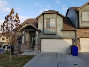 View of front of property featuring a garage