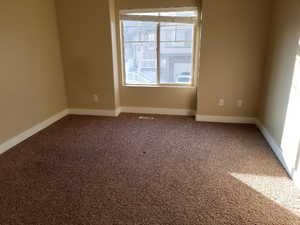 Spare room featuring carpet floors