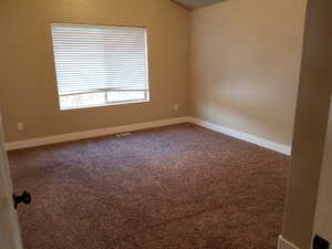 View of carpeted spare room