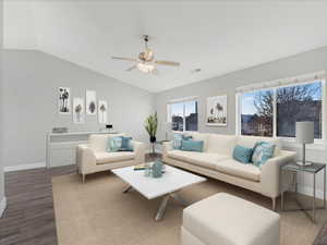 Living room with wood-type flooring, vaulted ceiling, and ceiling fan