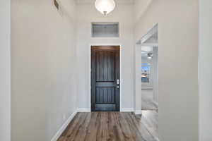 Entrance foyer featuring hardwood / wood-style floors