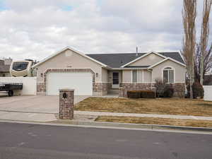 Ranch-style house featuring a garage