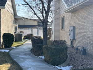 View of property exterior with central air condition unit