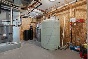 Utility room featuring heating unit