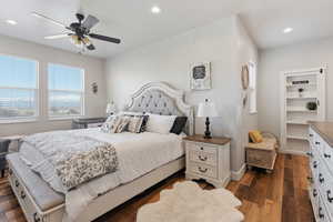 Bedroom featuring dark wood-type flooring and ceiling fan