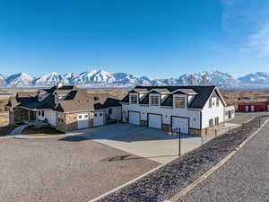 View of front facade with a mountain view and a garage