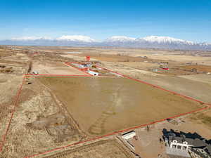 Birds eye view of property with a rural view and a mountain view