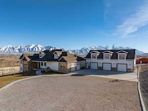 View of front of property featuring a mountain view and a garage