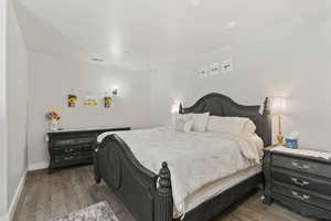 Bedroom featuring dark hardwood / wood-style floors