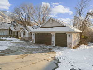 View of front facade featuring a garage