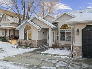 View of snow covered property entrance