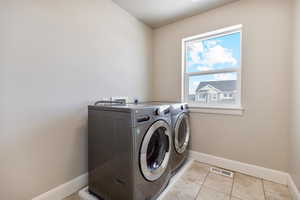 The laundry room is conveniently located on the second floor, along with the Primary Suite and 3 other bedrooms