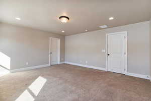 The Primary Suite is spacious and features a beautiful ensuite bathroom and a huge walk-in closet