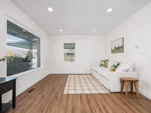 Living room with hardwood / wood-style flooring