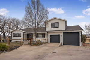 View of front of home featuring a garage