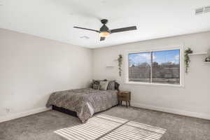 Bedroom featuring ceiling fan and light carpet