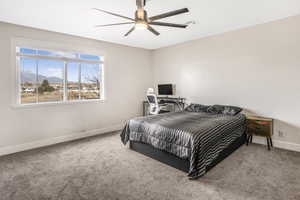 Bedroom with carpet flooring and ceiling fan