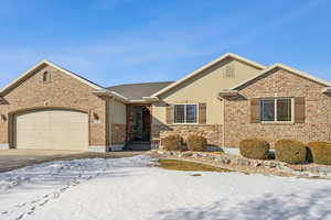 View of front of property featuring a garage