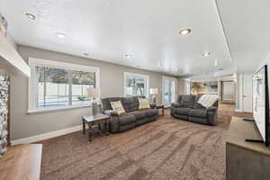 basement family room with fireplace, wet bar and walk-out