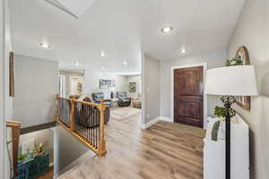 Foyer entrance with light hardwood / wood-style floors
