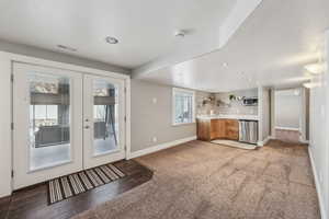 basement family room with fireplace, wet bar and walk-out