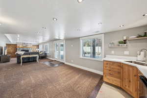 basement family room with fireplace, wet bar and walk-out
