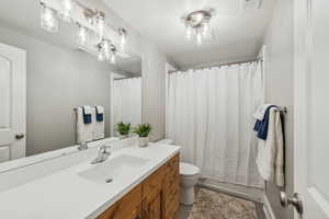 Bathroom with vanity and toilet