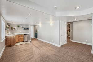 basement family room with fireplace, wet bar and walk-out