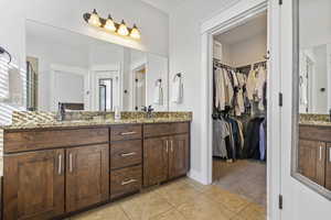 Bathroom with vanity and tile patterned flooring