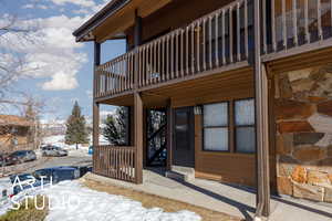 View of snow covered property entrance