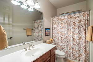 Bathroom featuring vanity and toilet