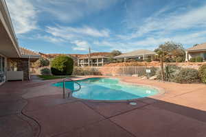 View of swimming pool with a patio