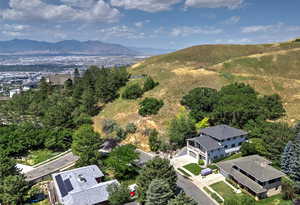 Birds eye view of property with a mountain view