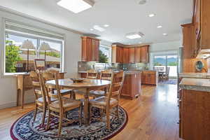 Dining room featuring crown molding and light hardwood / wood-style floors