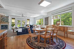 Dining space featuring ornamental molding and light hardwood / wood-style floors